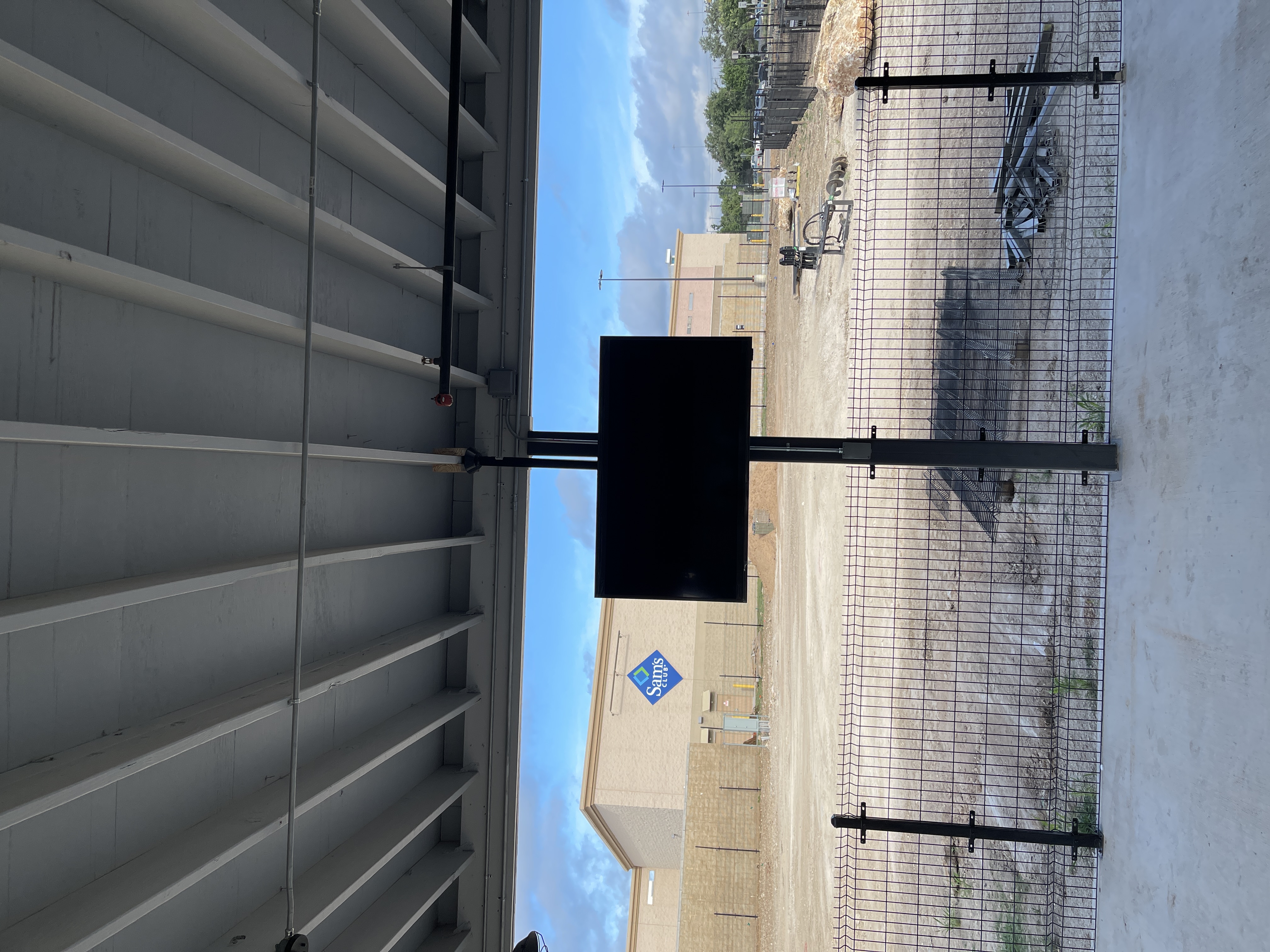 Back patio television mounted at Mutts K9 Cantina